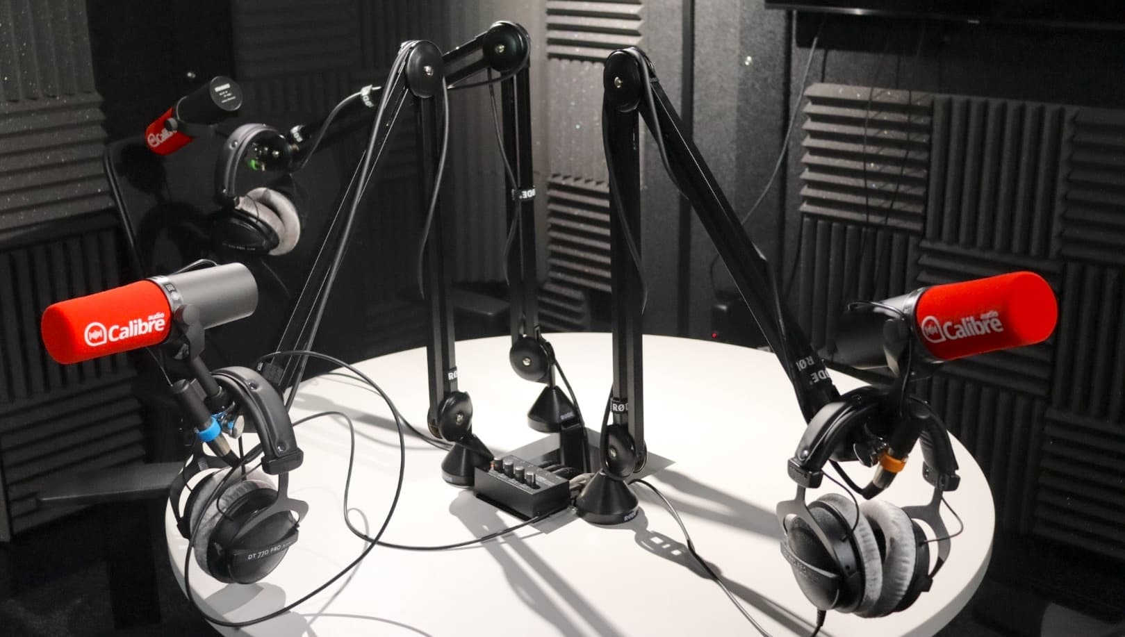 picture of inside the studio with microphones around a table